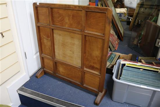 A Cotswolds School fruitwood fire screen with panels of hand embroidery scenes from Alice in Wonderland